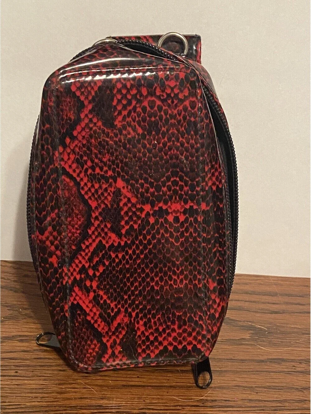 phone case red and black snakeskin look, vinyl. Fits I Phone.